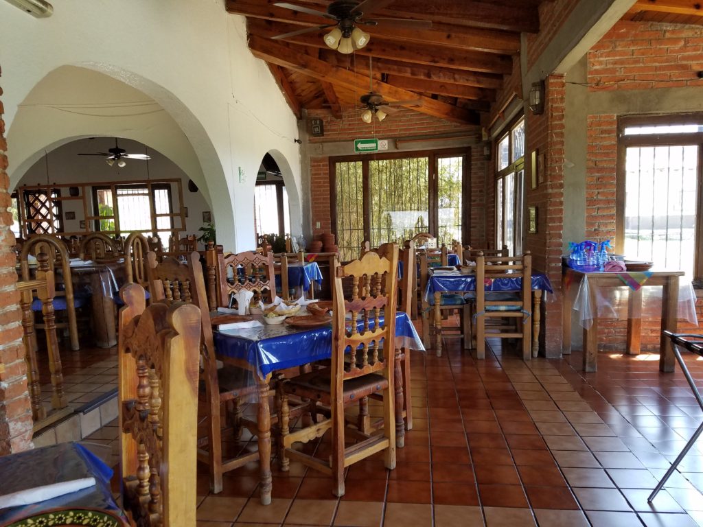 Inside La Casa de Mole- traditional brick walls and wooden tables