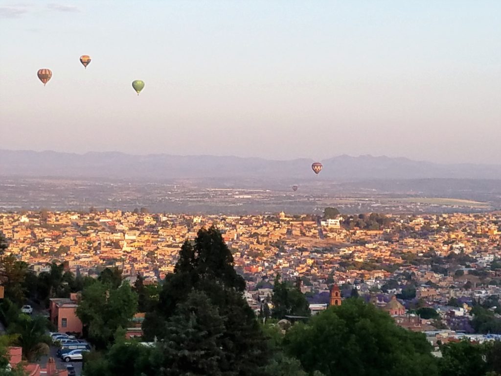 Hot air balloons at sunrise over San Miguel de Allende