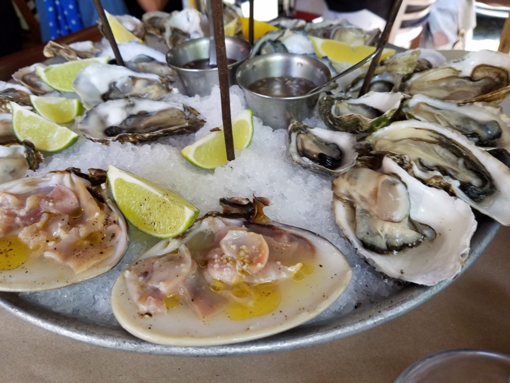 Fuente Royal seafood tower bottom layer with oysters and clams at La Docena Oyster Bar & Grill in Guadalajara, Mexico