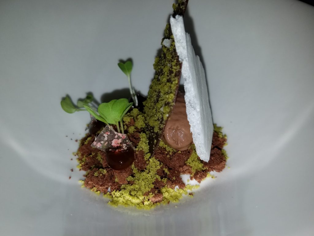 Dulce Amargor at Lula Bistro. Soft passion fruit candy, lavander ganache, burnt chocolate, dried chilaca chili pepper, dark chocolate ice cream, and pink pepper crystals at Lula Bistro in Guadalajara, Mexico Dulce Amargor at Lula Bistro. Soft passion fruit candy, lavander ganache, burnt chocolate, dried chilaca chili pepper, dark chocolate ice cream, and pink pepper crystals at Lula Bistro in Guadalajara, Mexico