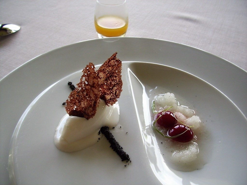 Coal Crumbs with Frozen Yogurt and Little Acid Touches of Strawberries, Lemon Grass, and a shot glass of Passion Fruit at Martin Berasategui