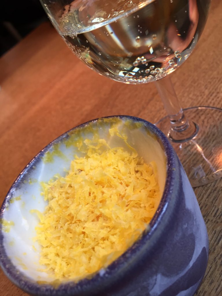 Yogurt, lemon and egg in a cup served with white wine