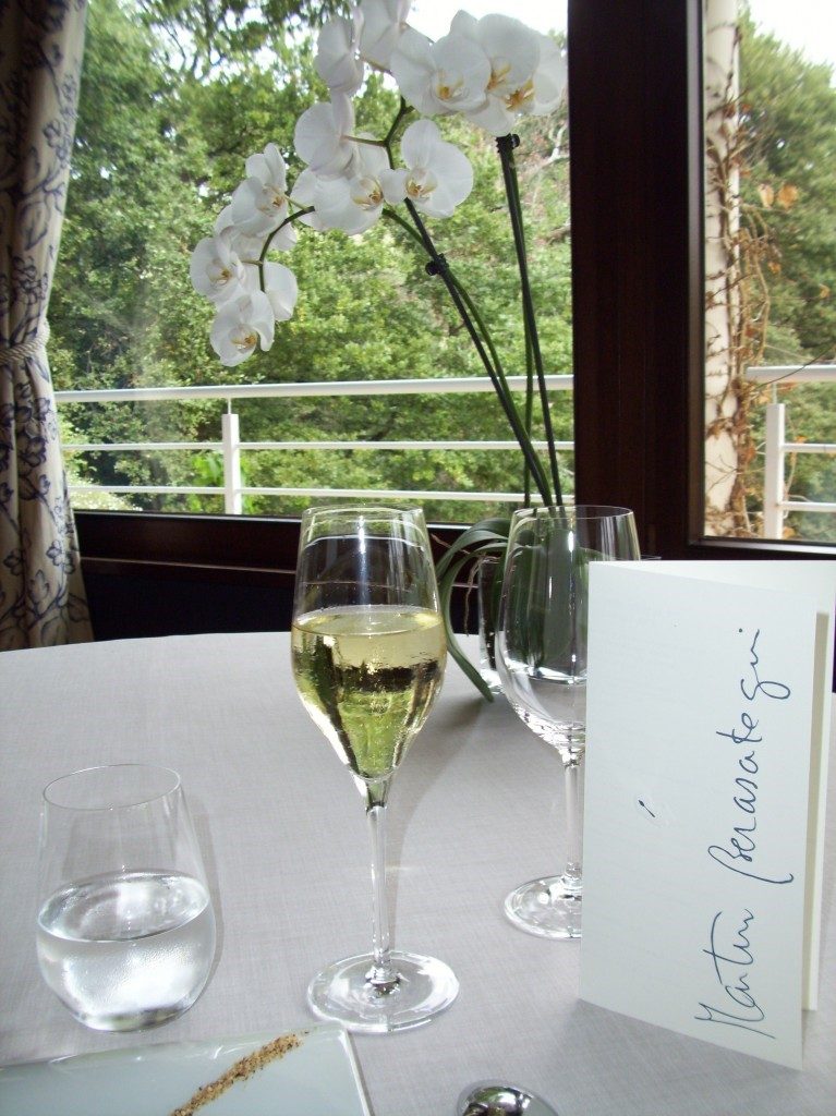 Champagne and menu on dining table at Martin Berasategui in Spain