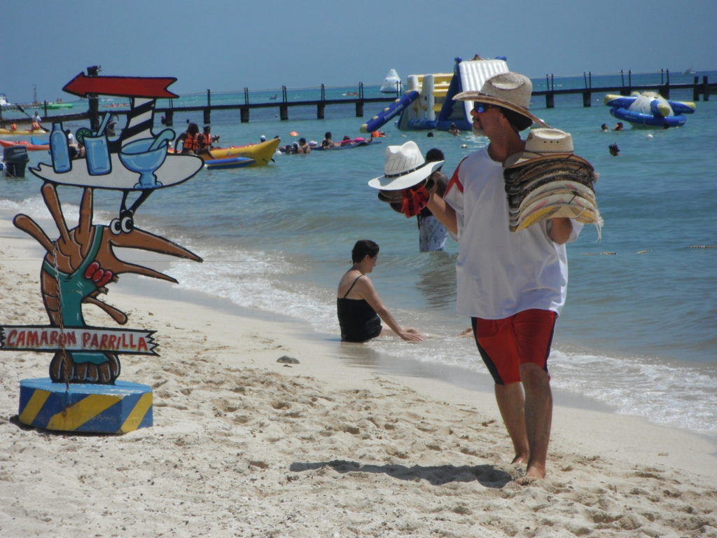 Hat salesman on Cozumel's west side beaches.