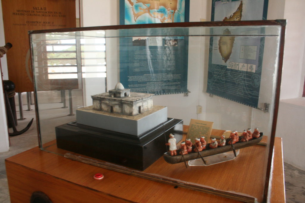Museum display of old Mayan temple and boat transportation at the lighthouse in Cozumel.
