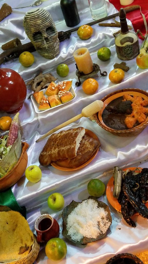 Different foods on an altar for Day of the Dead