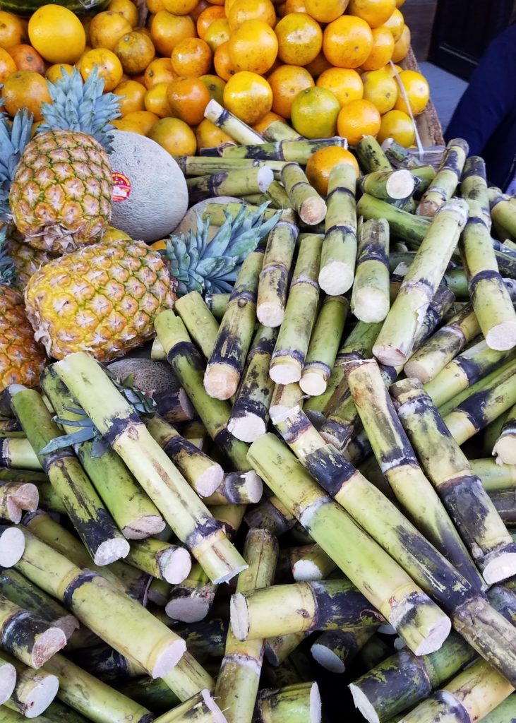 Sugarcane, pineapple and oranges at a small mercado Sugarcane, pineapple and oranges at a small mercado