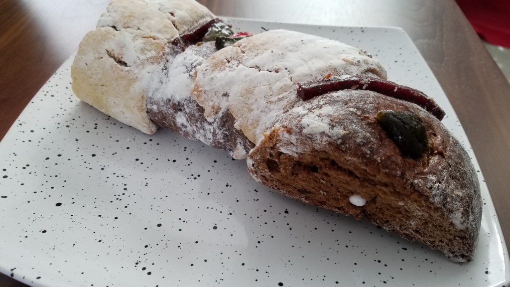 Rosca de Reyes cake with a baby Jesus peaking out.