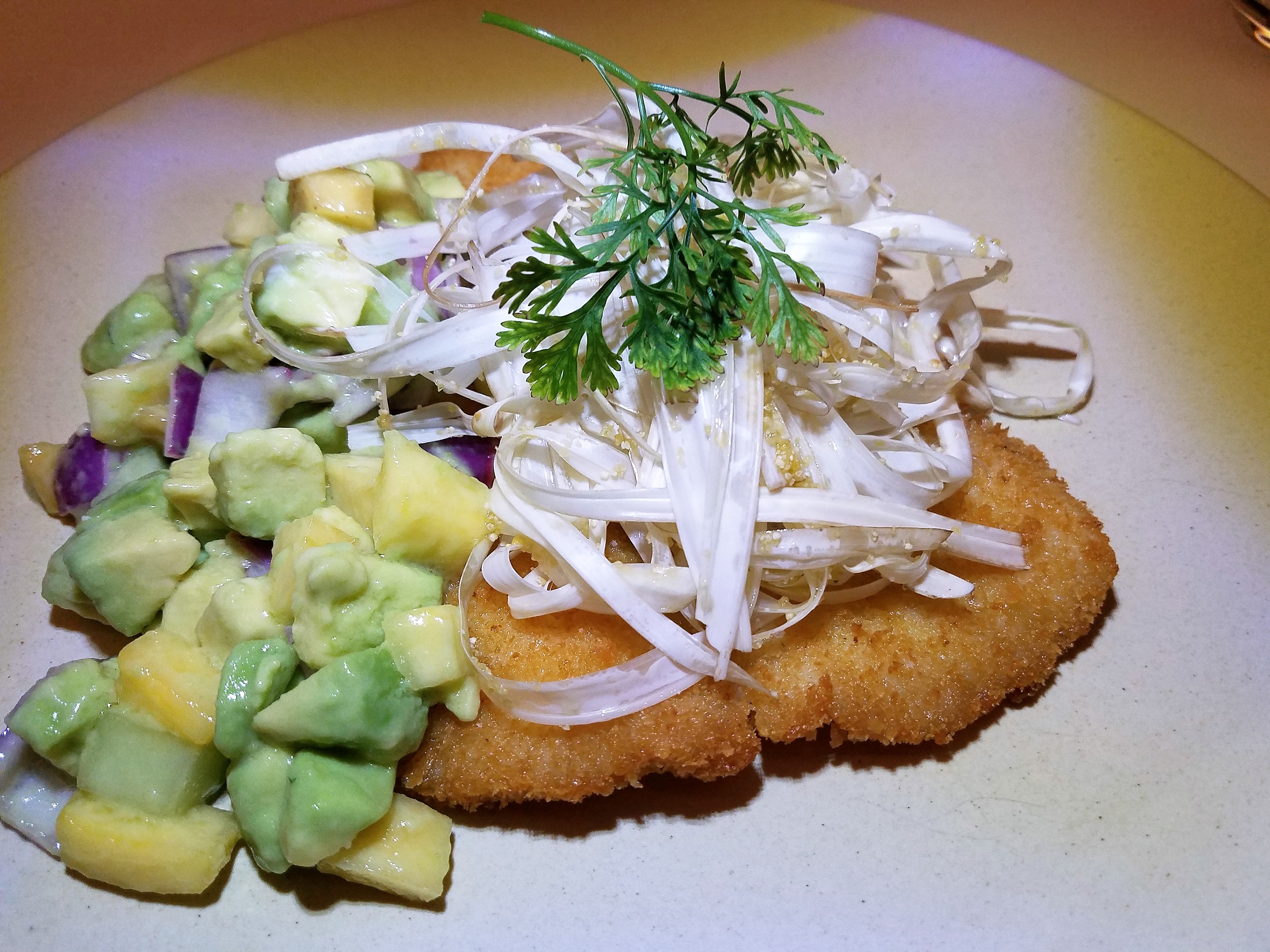 Crusted pan fried Paiche, cocona, cucumber and avocado salad with fresh heart of palms