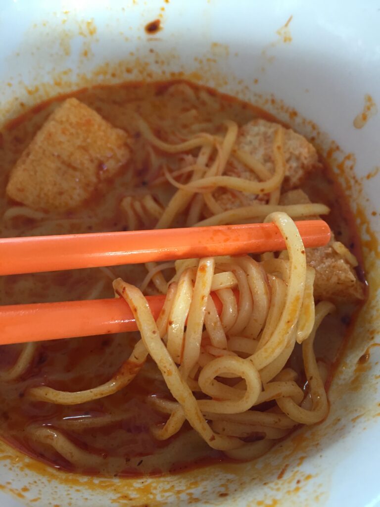 Singapore Laksa, a spicy, rice noodle soup with coconut milk, chicken and shrimp