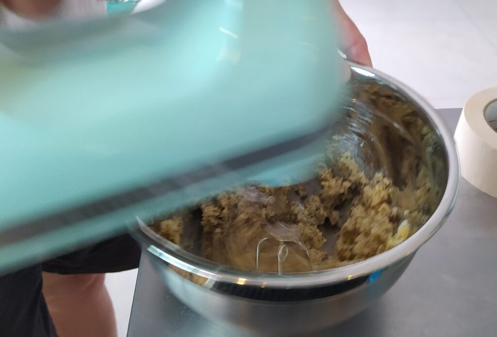 Mixing the ingredients together for a pineapple upside down cake.