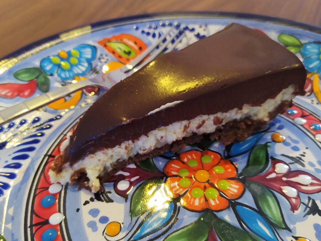 Slice of Licor 43 Cheesecake with Mexican Chocolate Ganache