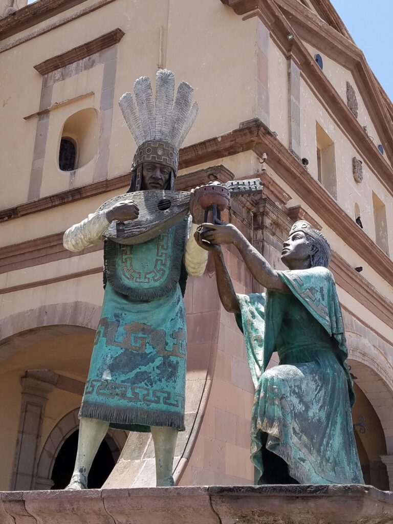 Otomi Indian statue outside Templo de la Santa Cruz, Queretaro