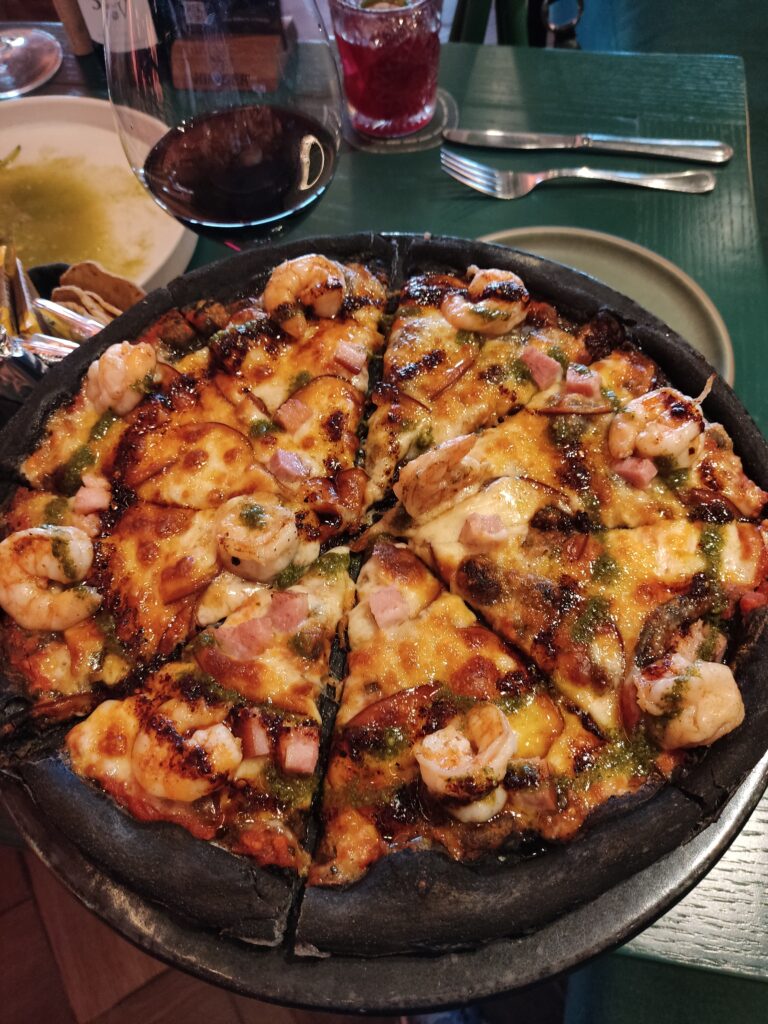 Charcoal pizza with grilled shrimp at Hunger Juriquilla, Queretaro, Mexico