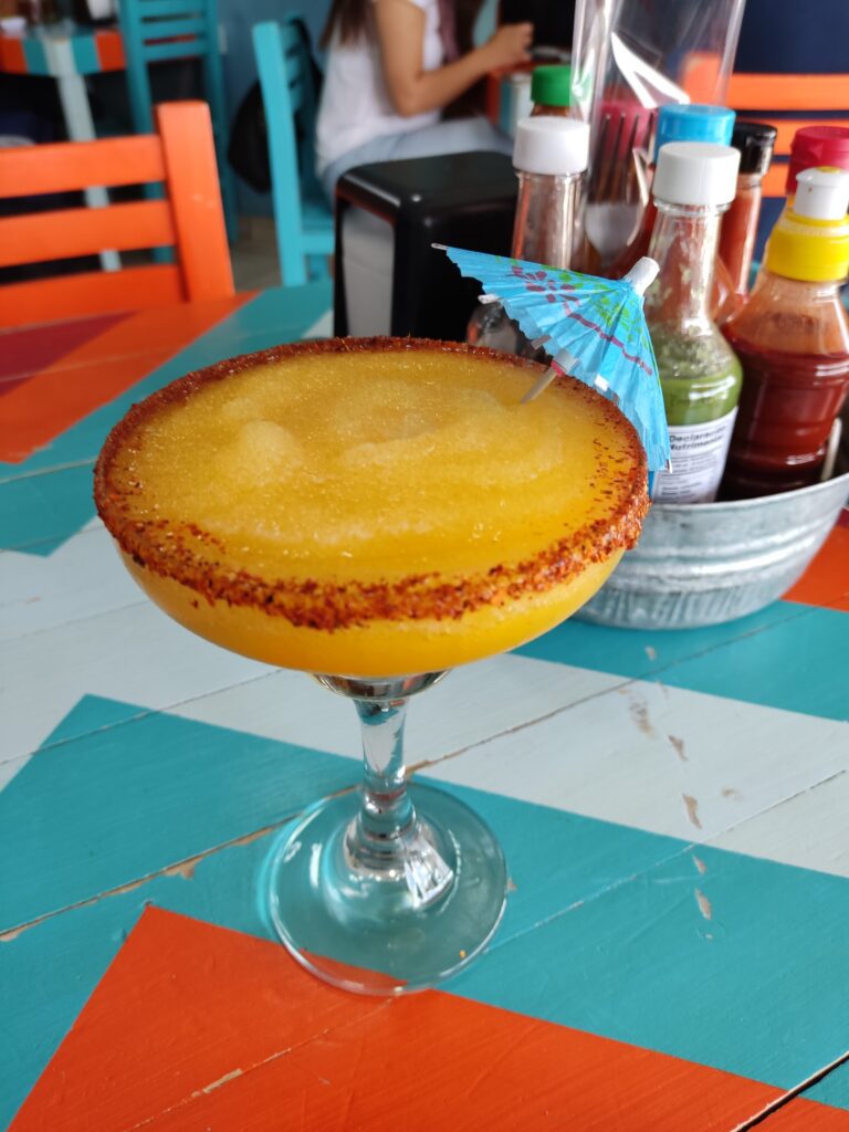 Frozen Spicy Mango Margarita with Tajin Rim